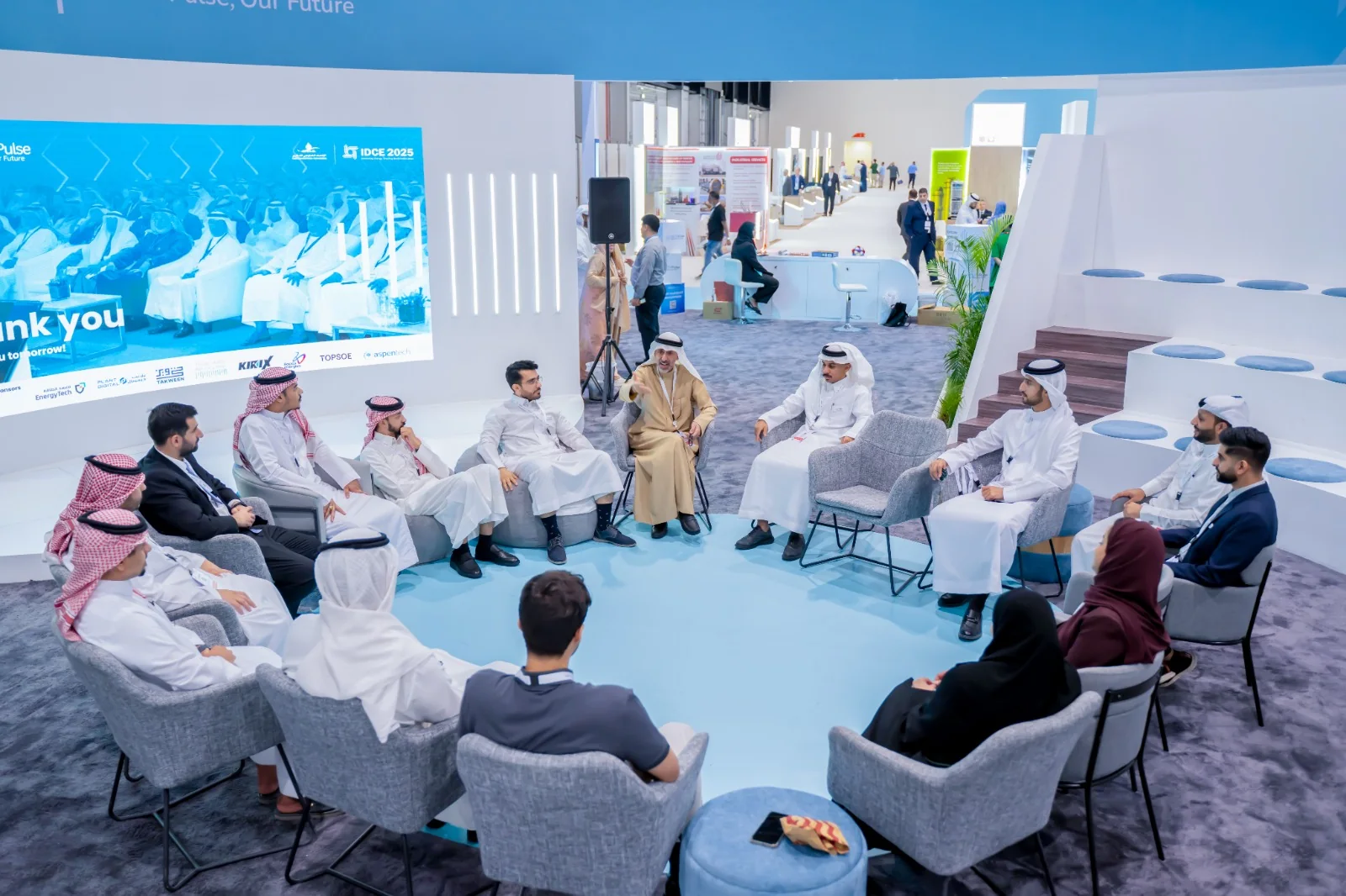 Participants and an industry expert in a circle discussion at the Youth Pulse stand, IDCE 2025